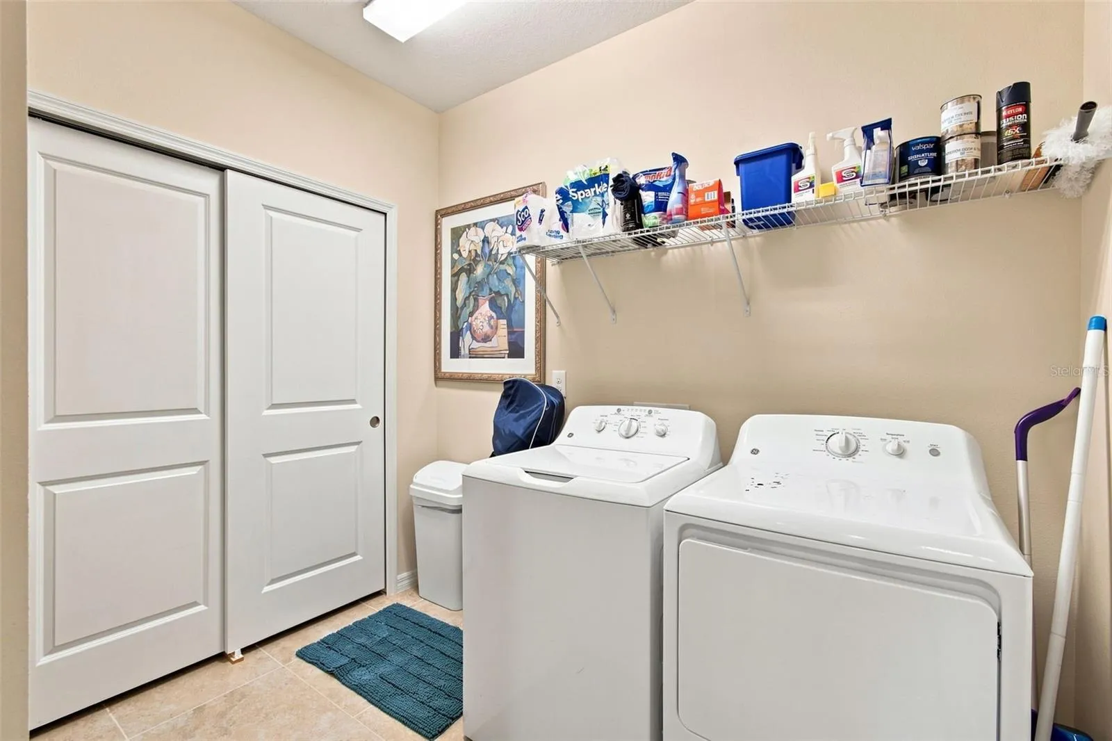 Laundry room with utility closet