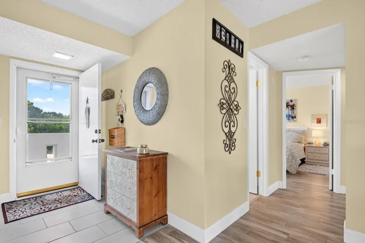 Entrance showing hallway to Guestbedroom and Guest Bath.