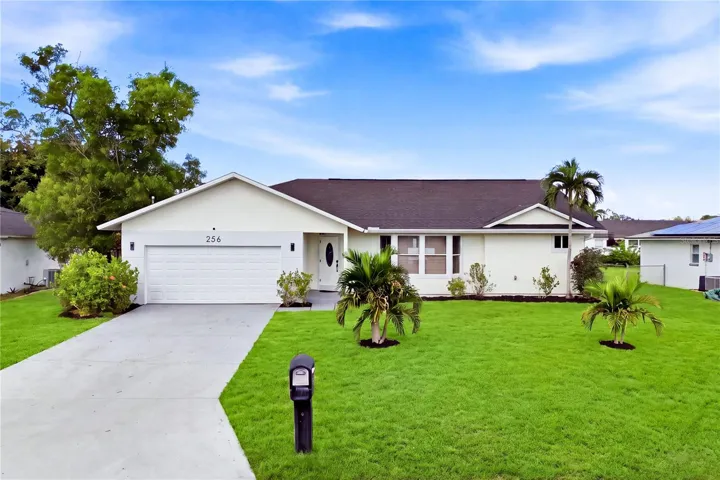 Attractive curb appeal welcomes you w/ tropical palms, expansive lawn & attached 2-CAR GARAGE.