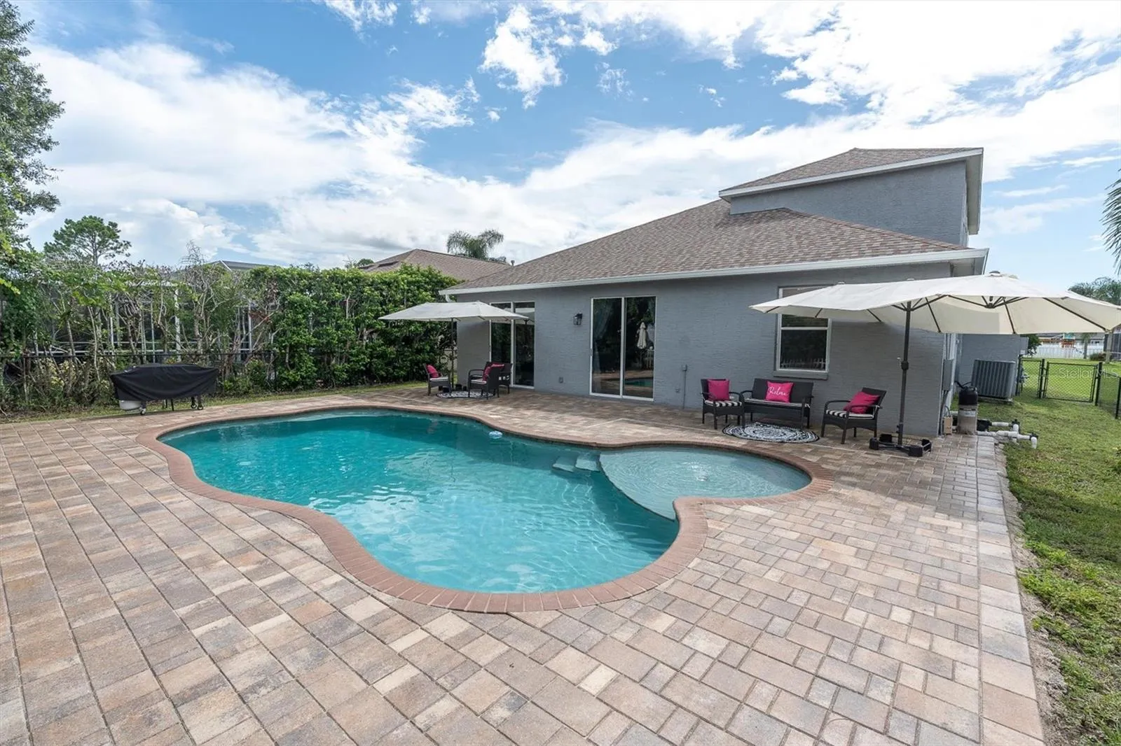 SPACIOUS PAVER DECK AND GLISTENING POOL