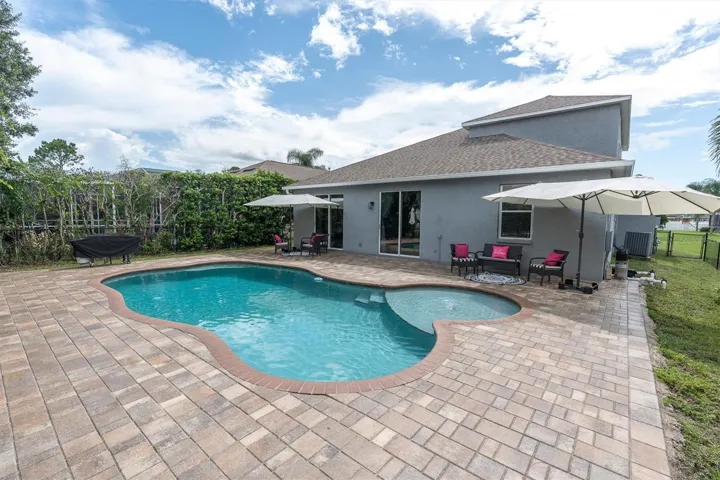 SPACIOUS PAVER DECK AND GLISTENING POOL