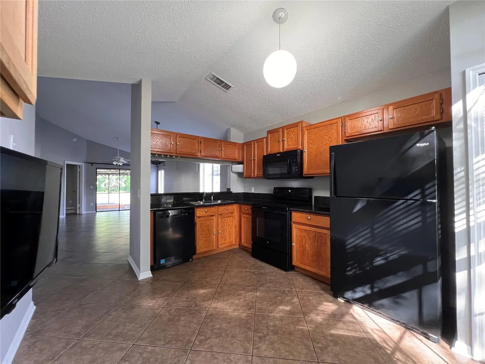Wood cabinets, microwave, stove and refrigerator