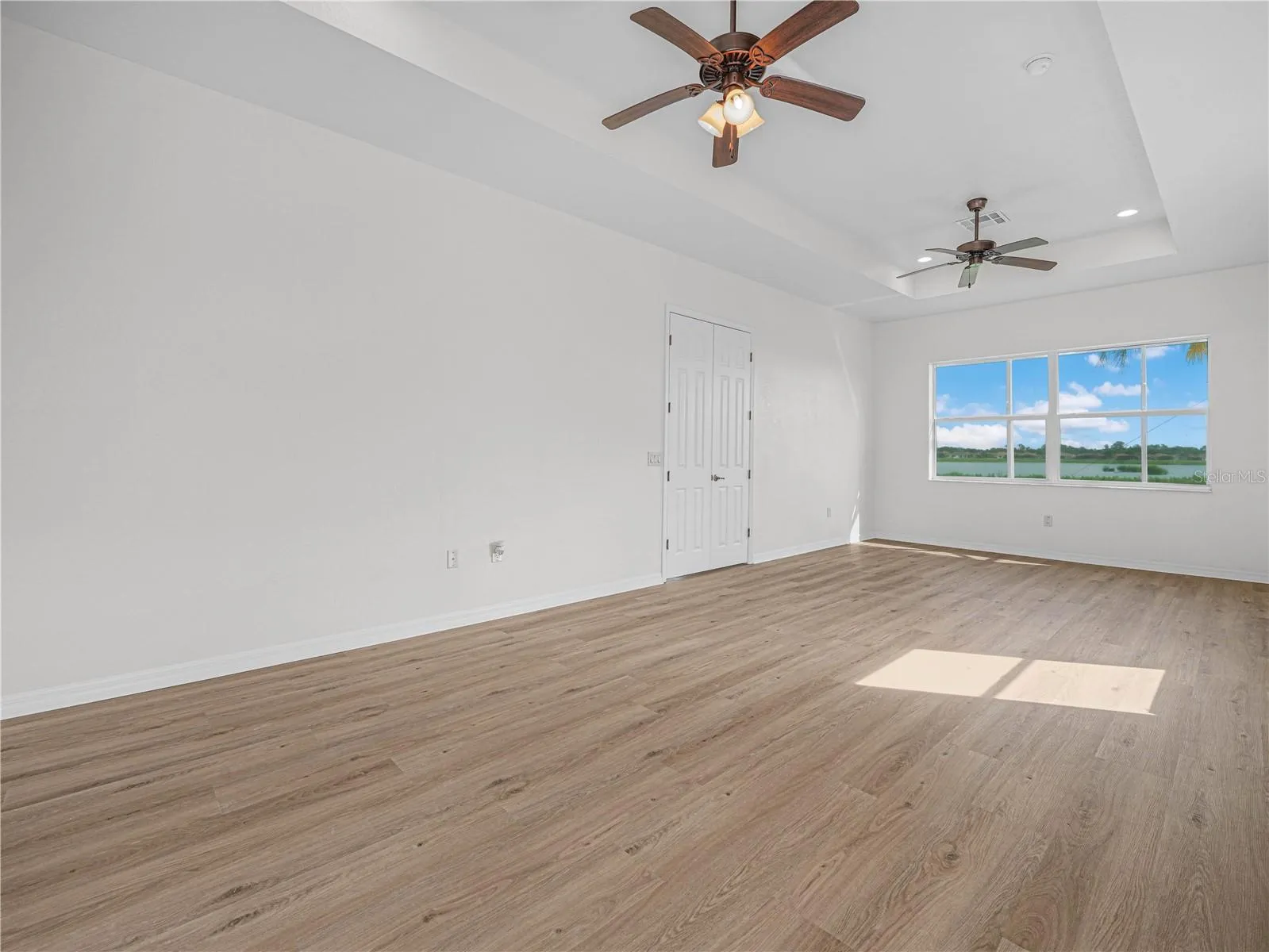 Expanded Primary Suite with Trey Ceiling, Ceiling Fans and Double Windows. New LV Flooring