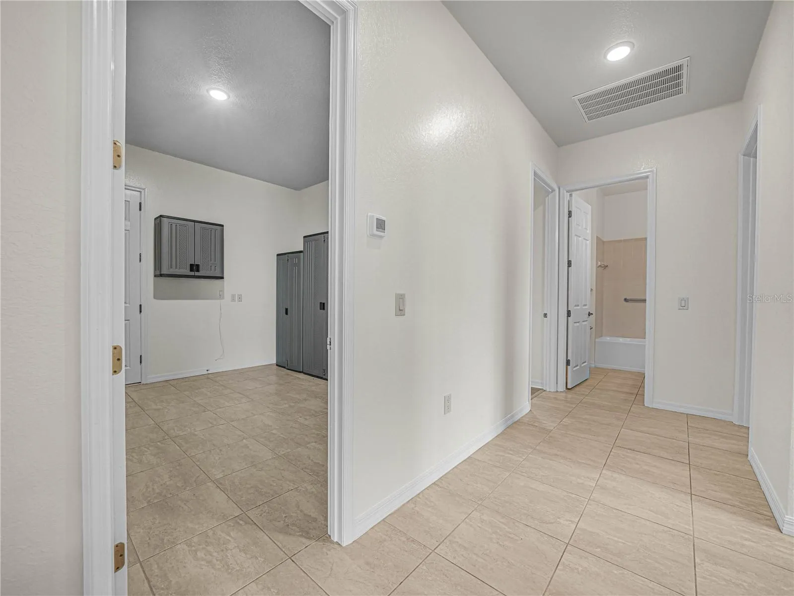 Hallway from LR to Laundry Room and BR 3 and 2nd Suite. Bath 3