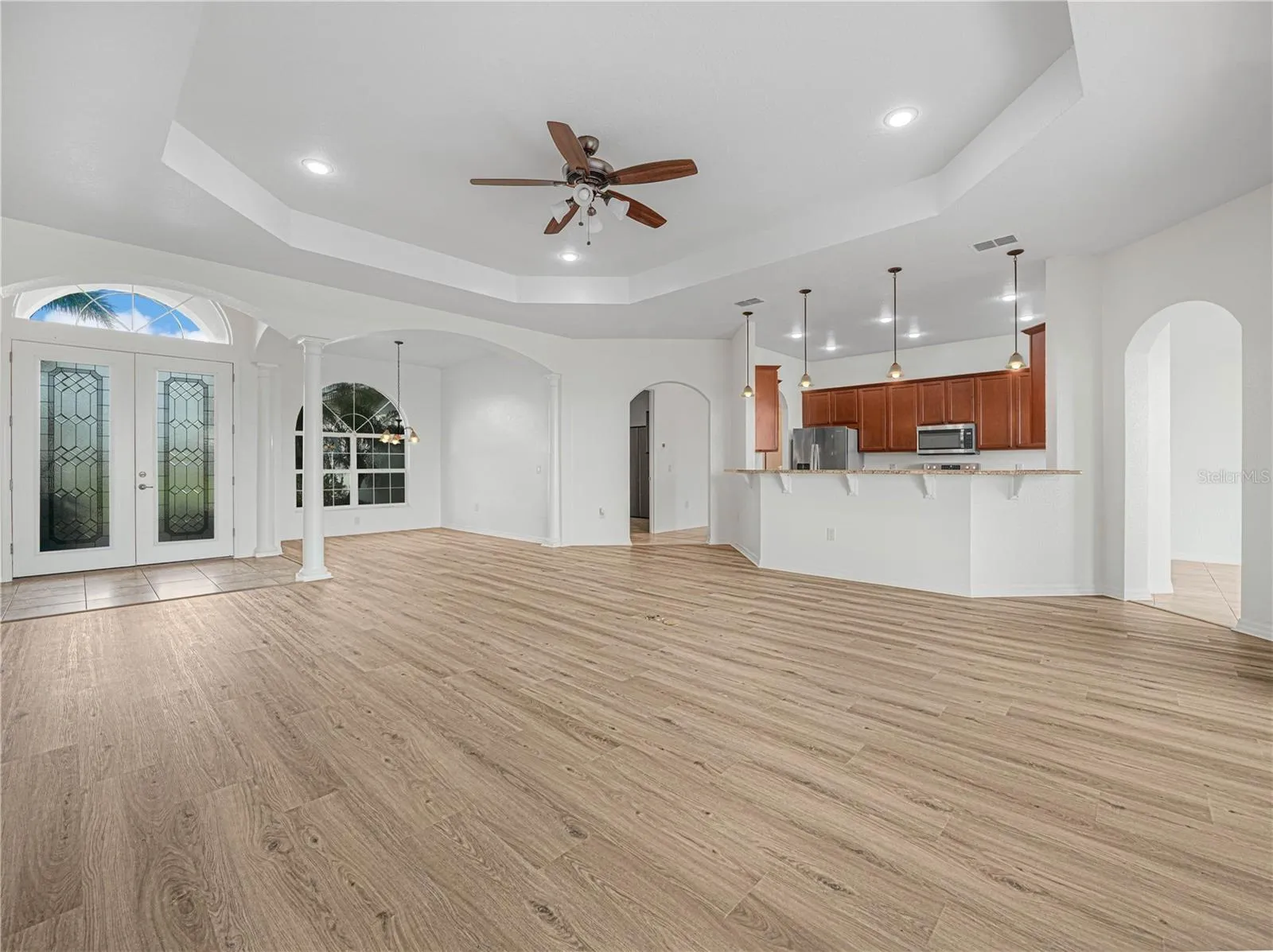 Double Glass Doors, Trey Ceiling. Formal Dining and Kitchen Area