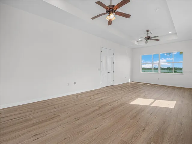 Expanded Primary Suite with Trey Ceiling, Ceiling Fans and Double Windows. New LV Flooring