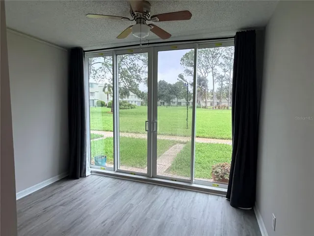 Bonus room looking out to courtyard in back of unit