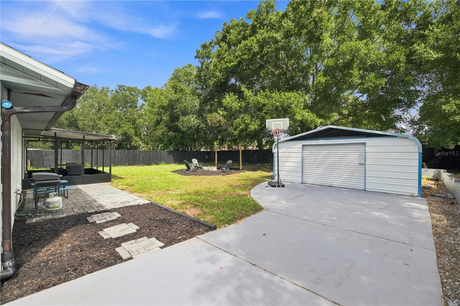 Oversized driveway with detached metal building