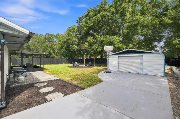 Oversized driveway with detached metal building