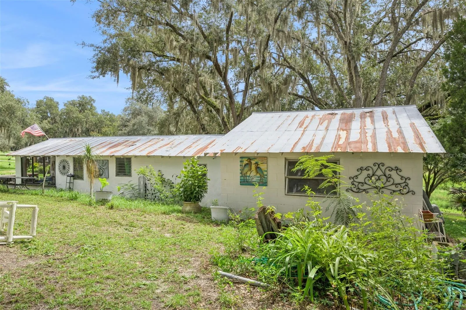 Additional outdoor workspace and storage, perfect for hobbies, projects, or a private studio. Used to be a home and can be converted back.