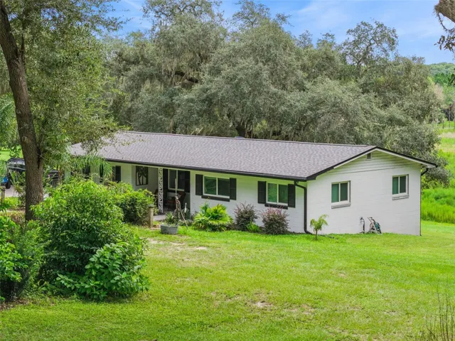 Overhead view revealing the full footprint of this one-of-a-kind Fruitland Park property.