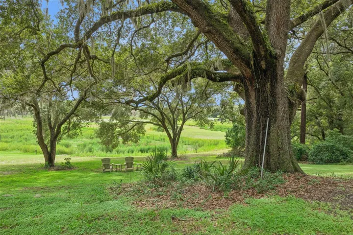 Winding paths and natural landscaping invite you to explore every corner of this serene retreat.