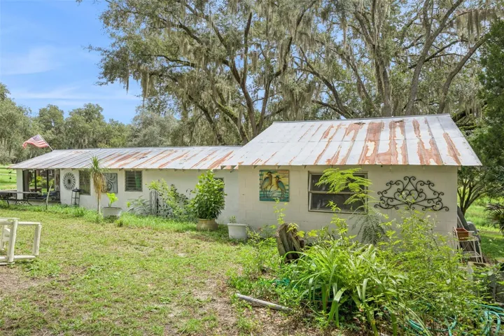 Additional outdoor workspace and storage, perfect for hobbies, projects, or a private studio. Used to be a home and can be converted back.