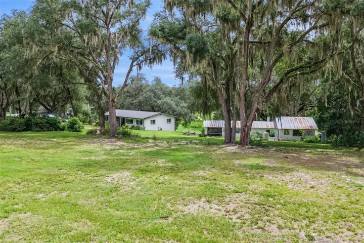 Aerial perspective highlighting the property's generous acreage and the natural beauty of the Fruitland Park countryside.