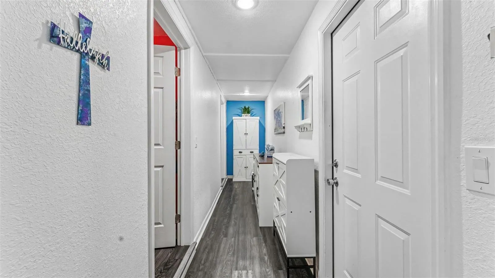 Hallway to laundry, 2nd bathroom and carport to the right