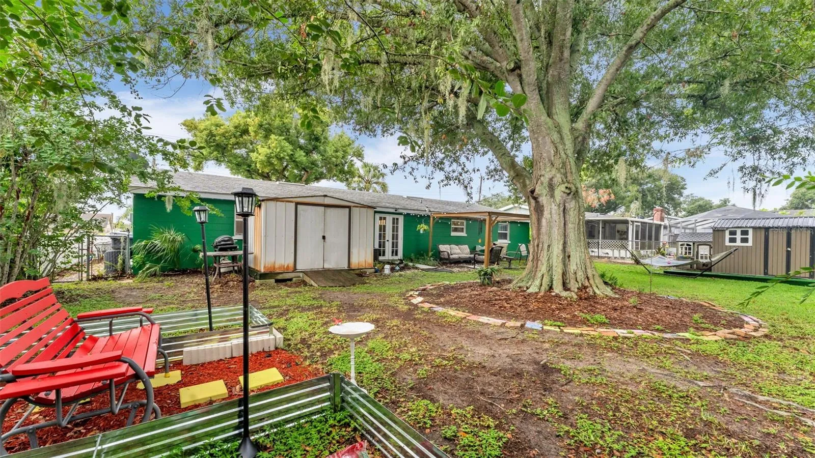 Back yard with beautiful oak tree