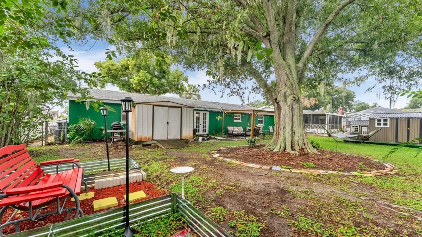 Back yard with beautiful oak tree