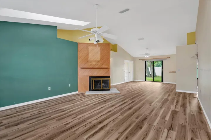 Living Room, Dining Room and French Doors leading into Office.  Sliders leading out to patio in backyard.