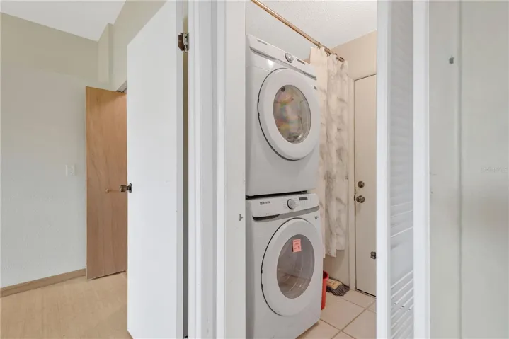 Inside Laundry/Mud Room with door into 2 Car Garage.