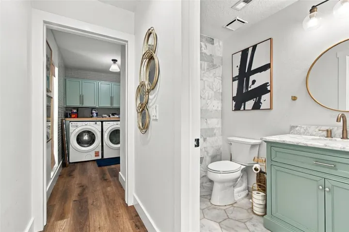 Guest bathroom and laundry room off the kitchen