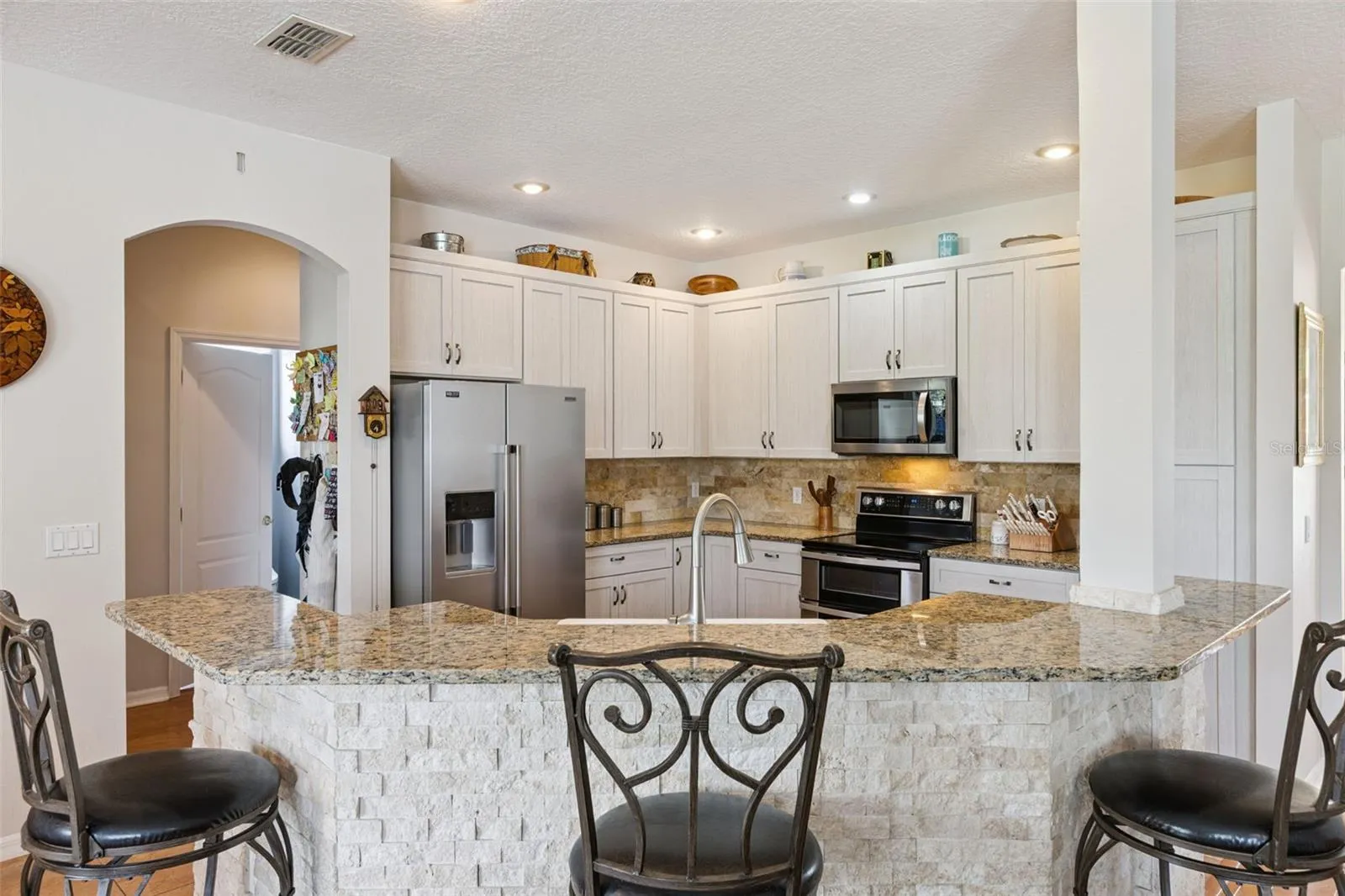 Updated Kitchen with Stainless Steel Appliances and Granite Counters