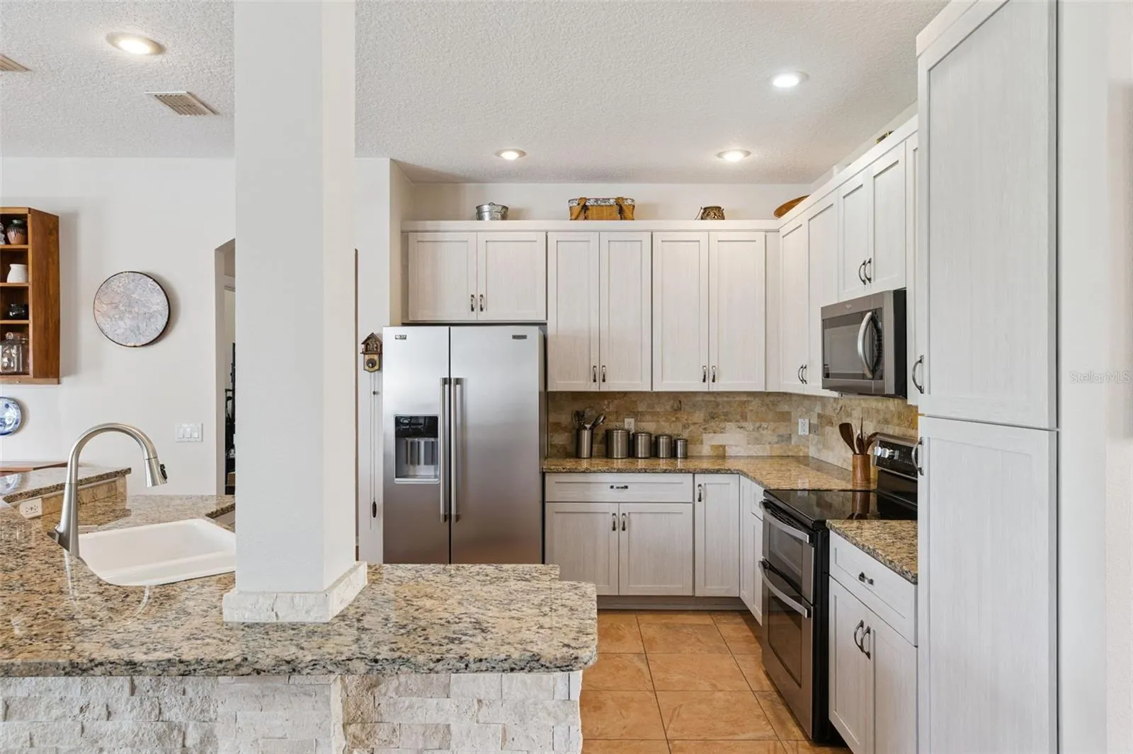 Updated Kitchen with Stainless Steel Appliances and Granite Counters