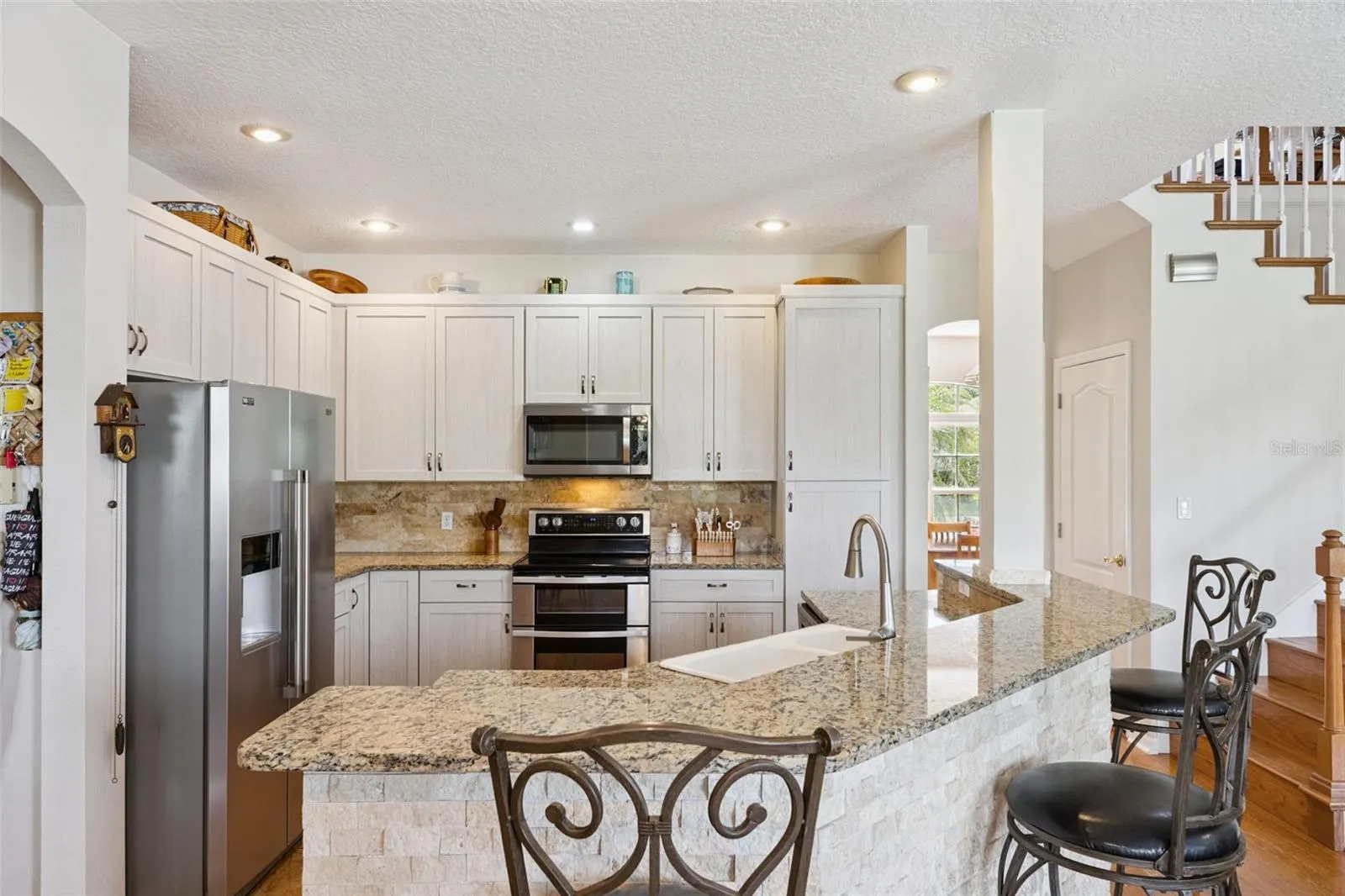 Updated Kitchen with Stainless Steel Appliances and Granite Counters