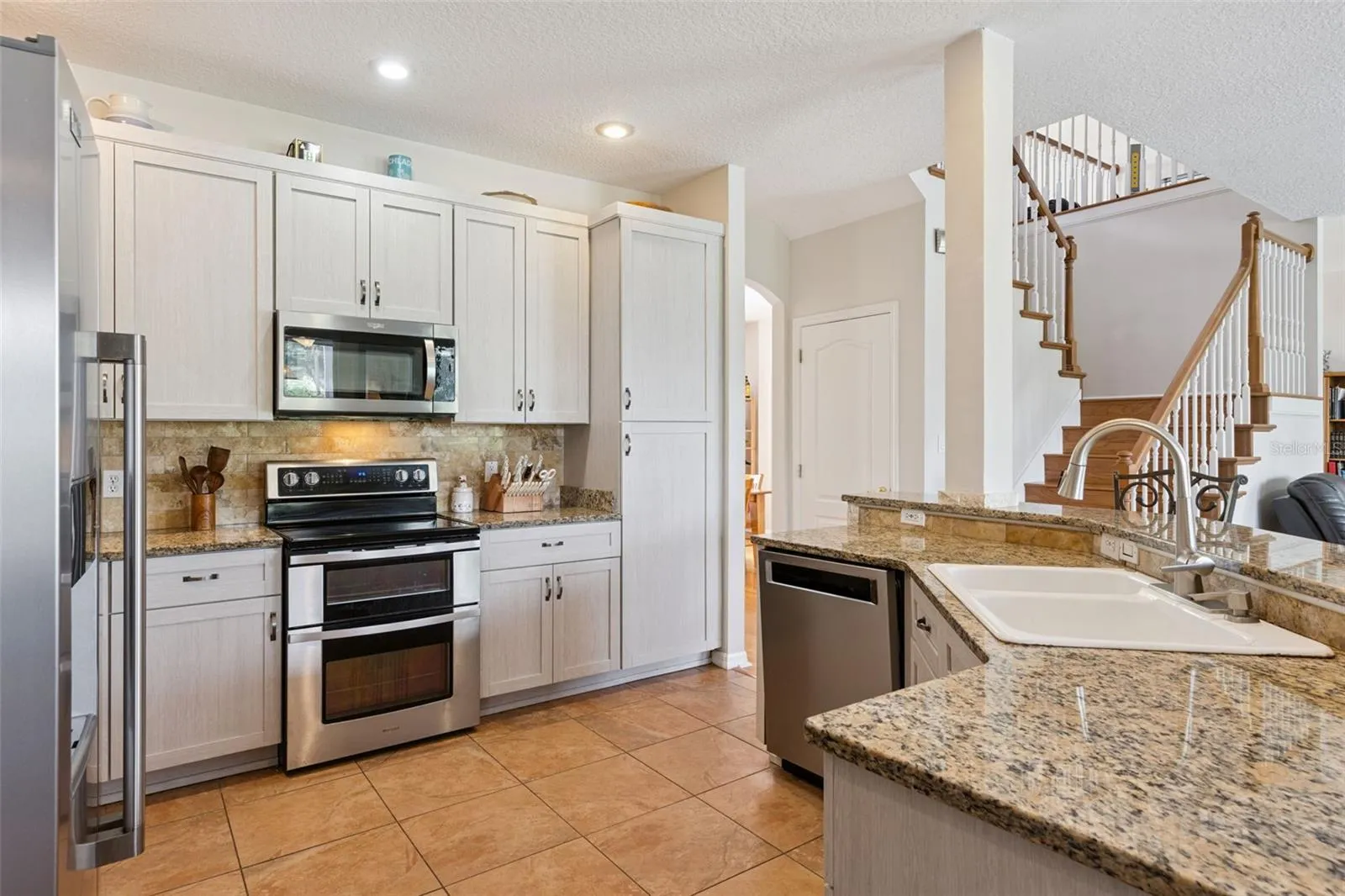 Updated Kitchen with Stainless Steel Appliances and Granite Counters
