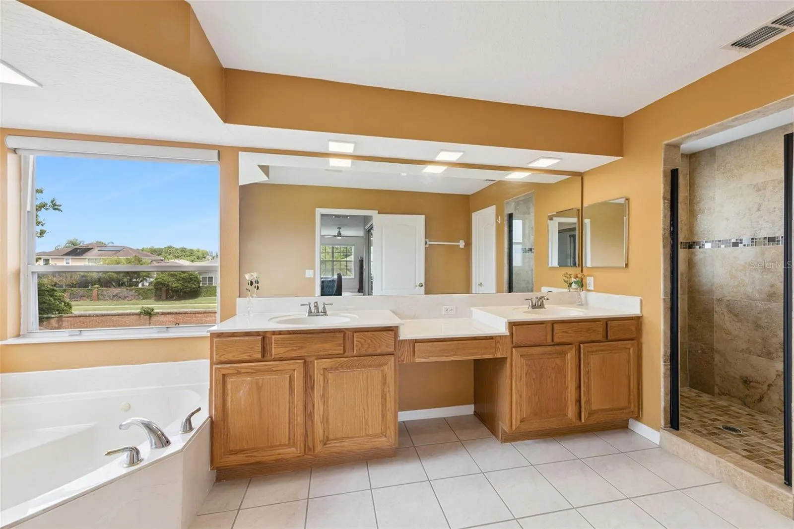 Primary En Suite Bathroom with Jacuzzi Tub and Separate Shower