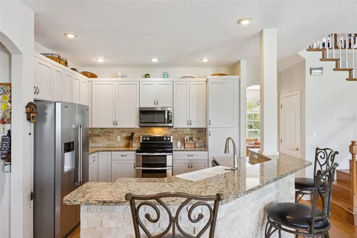 Updated Kitchen with Stainless Steel Appliances and Granite Counters
