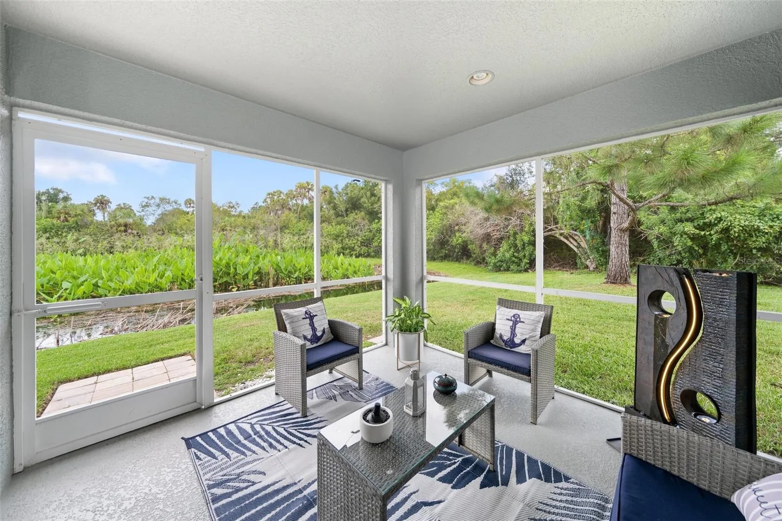 Screened Lanai with pond and nature view