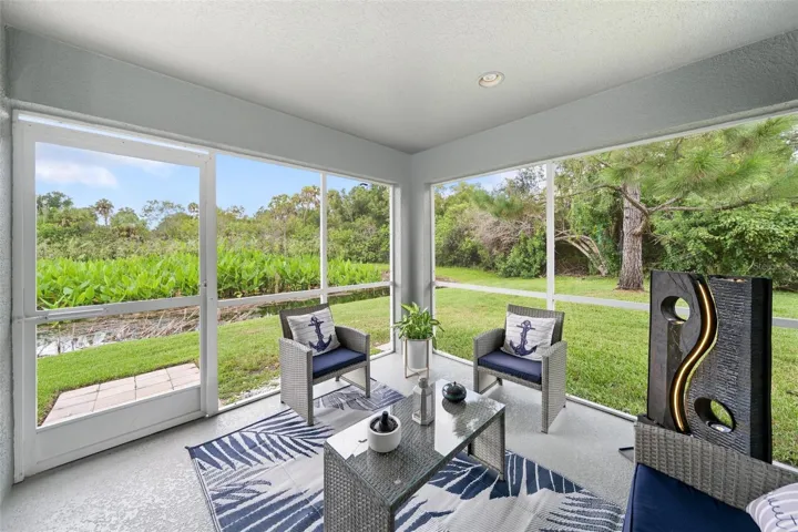 Screened Lanai with pond and nature view