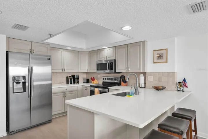 Bright clean kitchen with lots of cabinet and counter space
