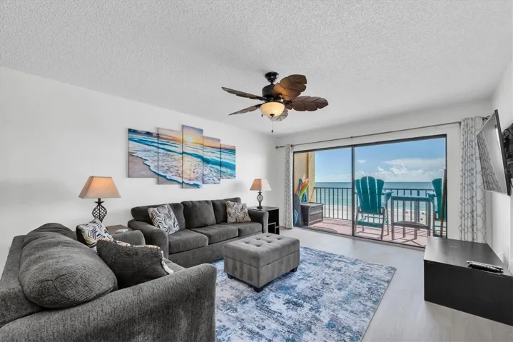 Large living room with balcony access and lovely views