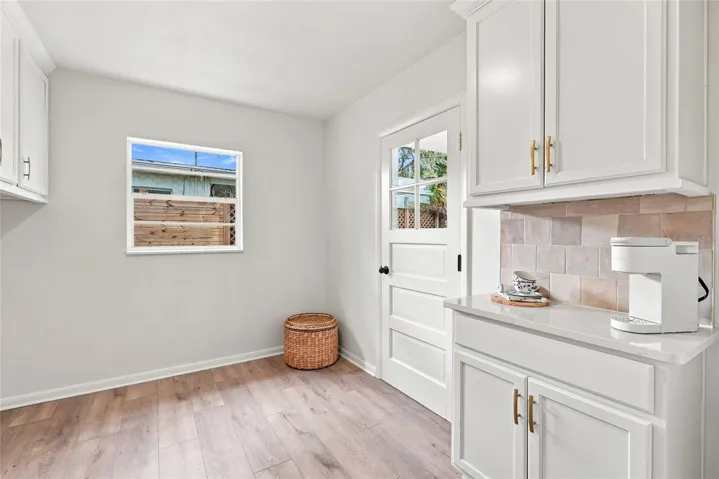 Inside Laundry Room with Built In Cabinets