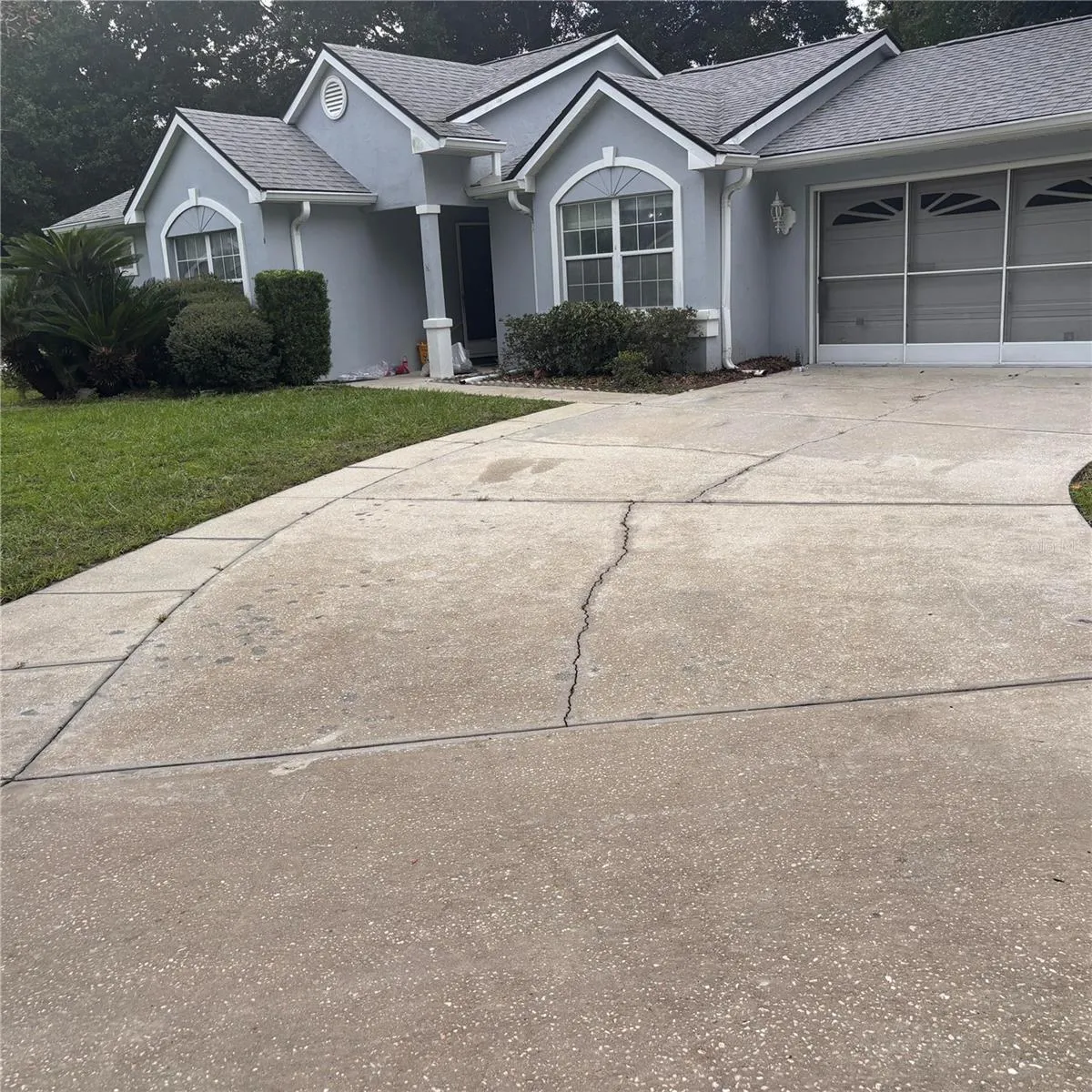 front of house with large driveway