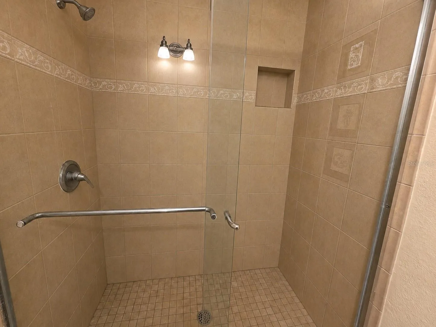 walk-in shower with glass doors