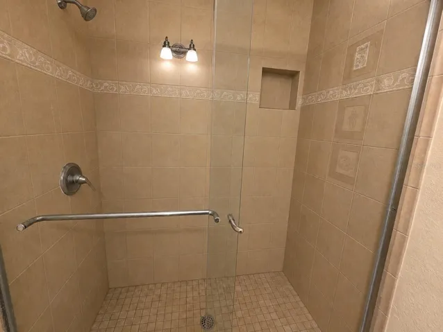 walk-in shower with glass doors