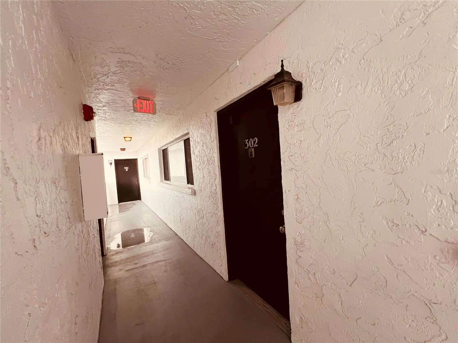 Unit hallway leading to stairs.