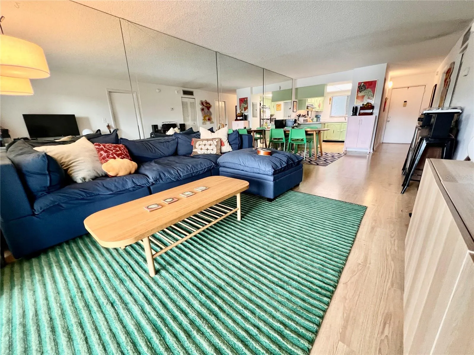Spacious living area with hardwood floors.