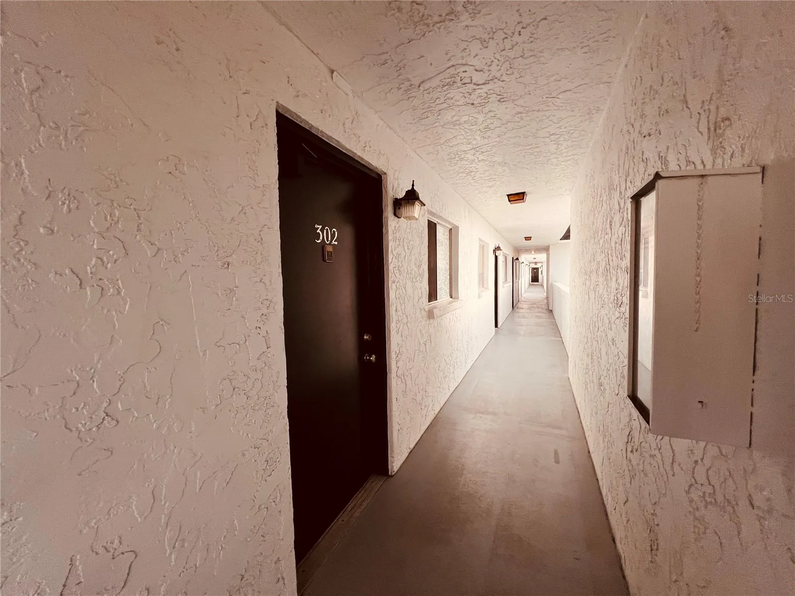 Unit hallway leading to elevator.