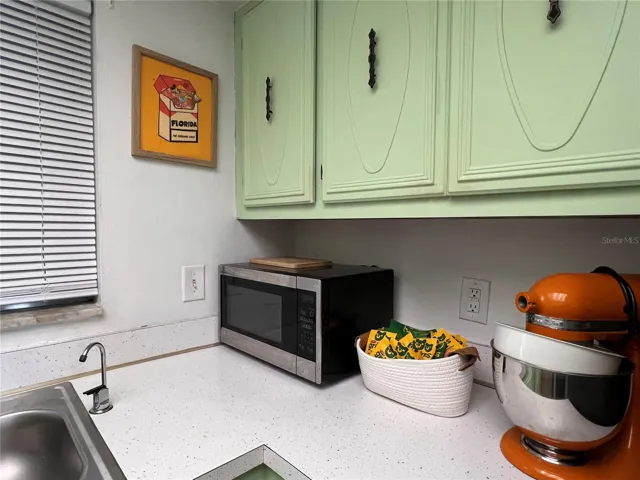 Large window in the kitchen let's in natural light.
