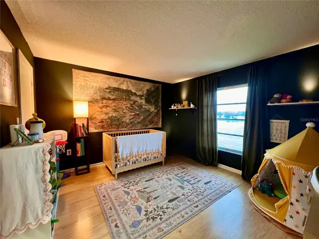 Larger of the Ensuite Bedrooms with lake views is currently being used as a nursury and playroom.
