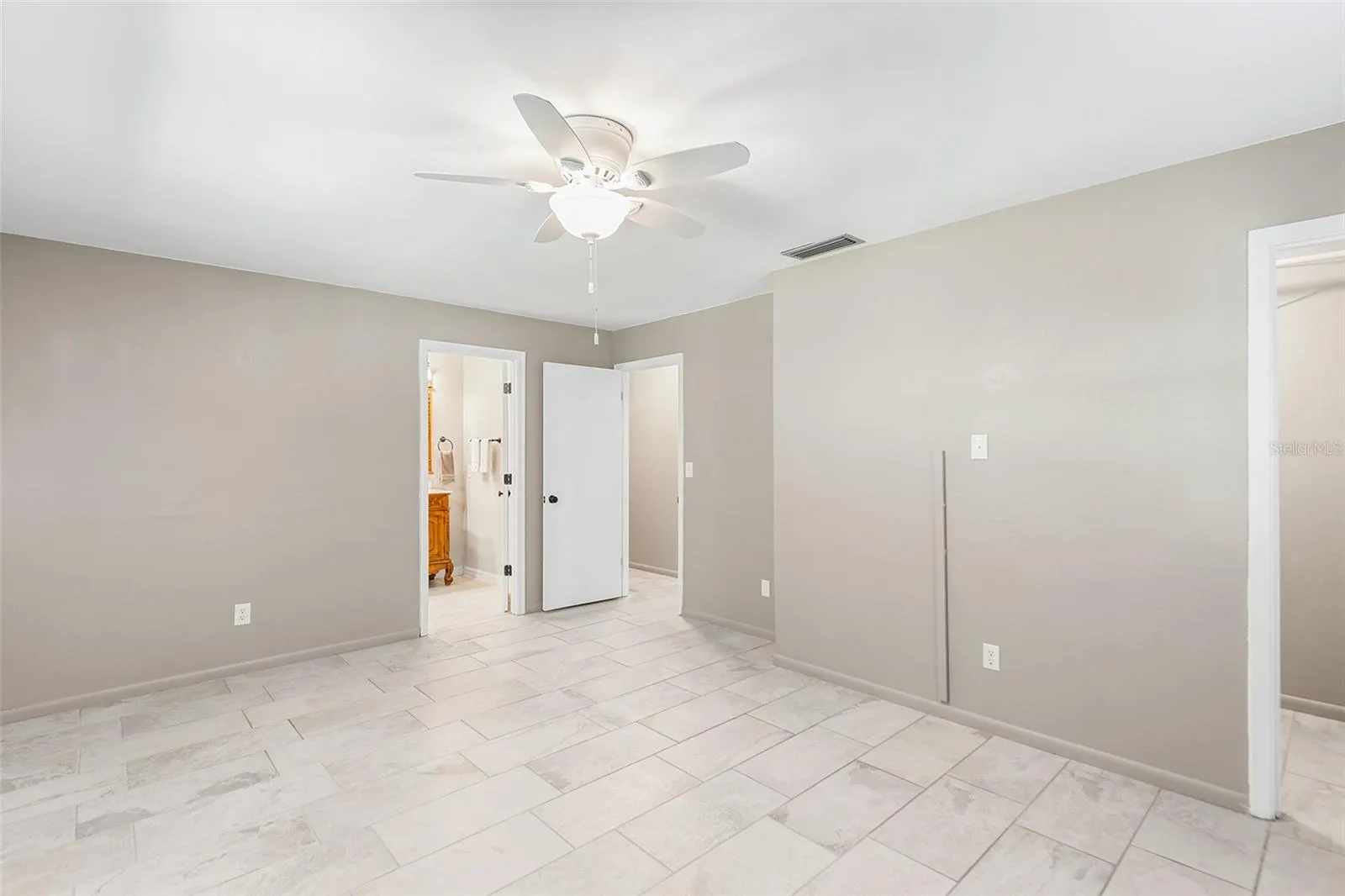 Primary Bedroom is light, airy and SPACIOUS!