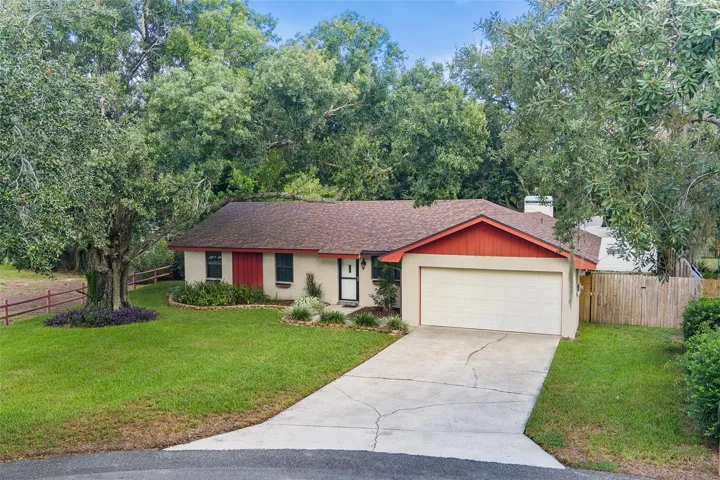 Exterior front with spacious driveway &amp; yard