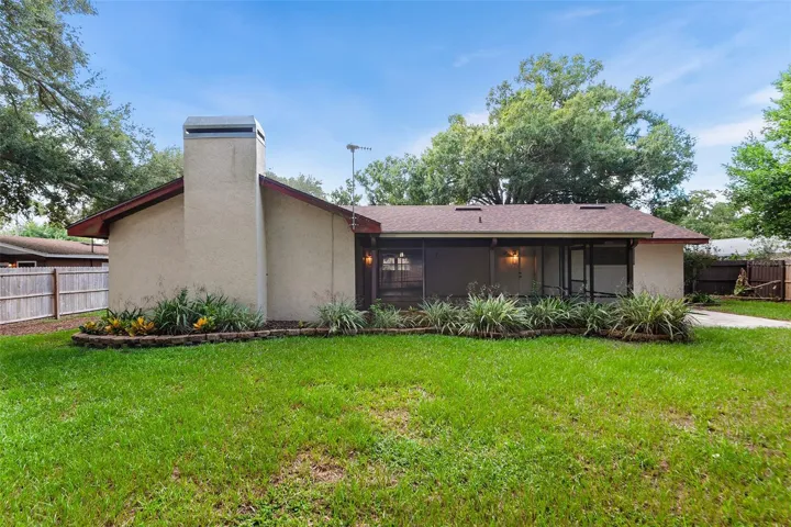 Rear view of home &amp; large screened patio