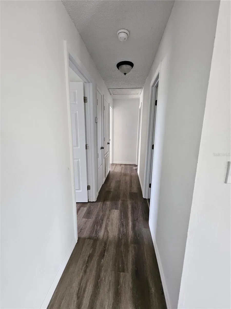 hallway to other 3 bedrooms