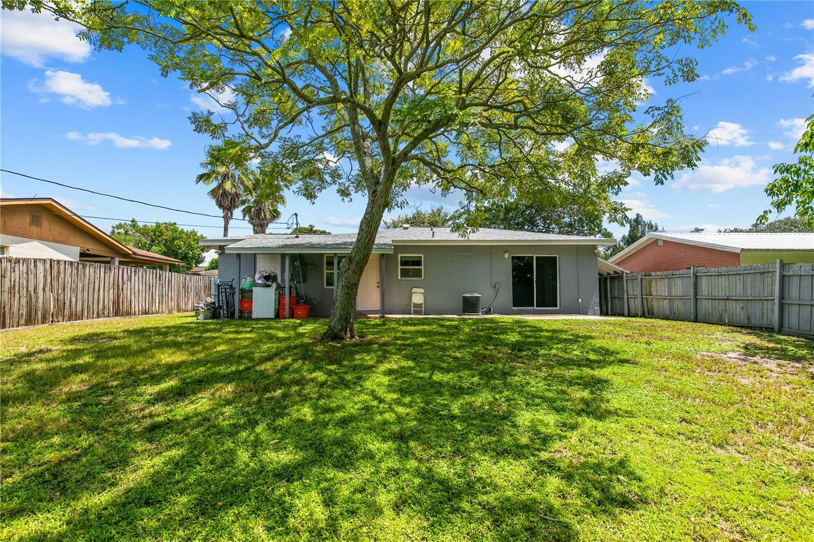 Fenced Backyard with Mature Trees