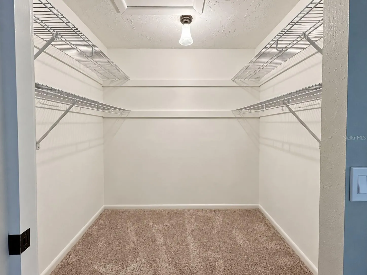 Primary bedroom walk in closet.