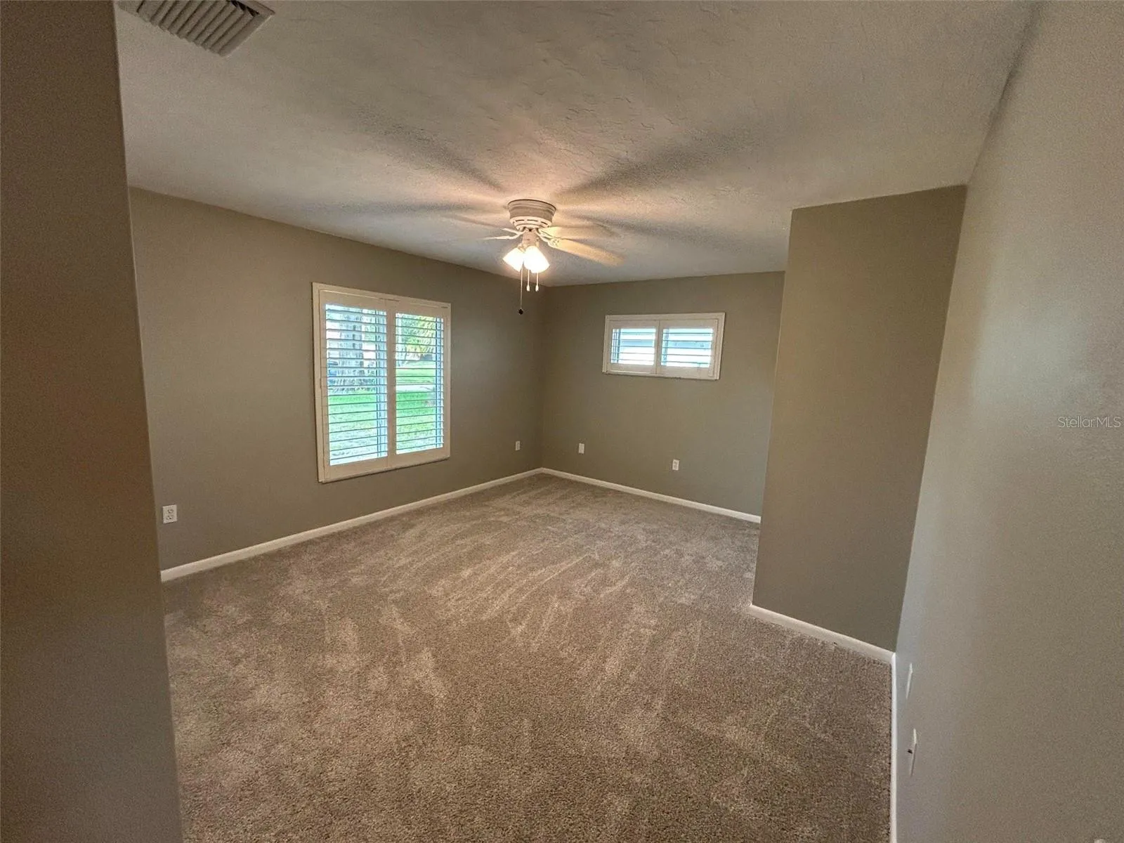 Bedroom #3 Primary suite has a walk in closet located on a split level design from other bedrooms.